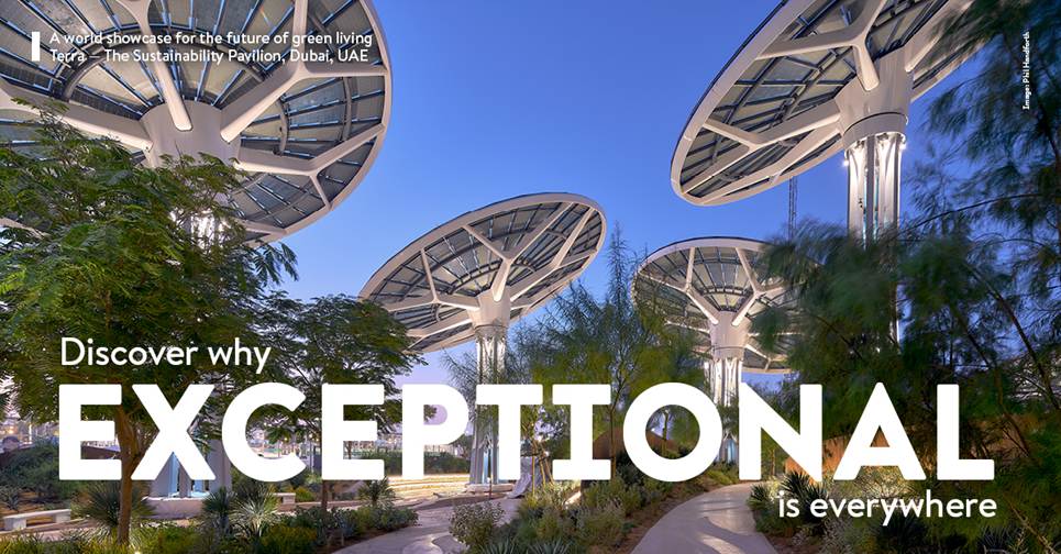 A group of circular structures with trees and blue skyDescription automatically generated