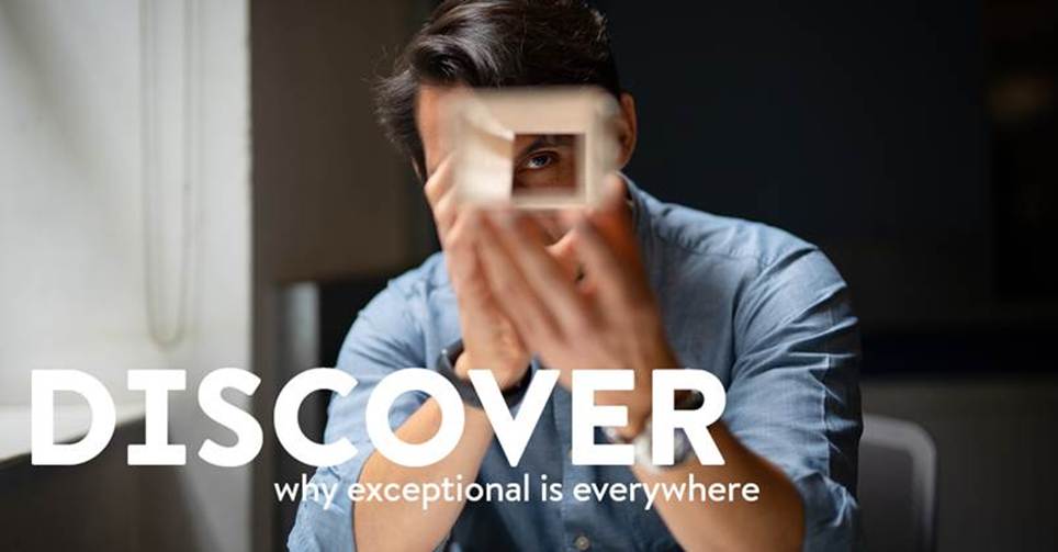 A person holding a square objectAI-generated content may be incorrect.